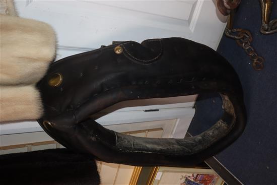 A heavy horse leather collar and brass hames